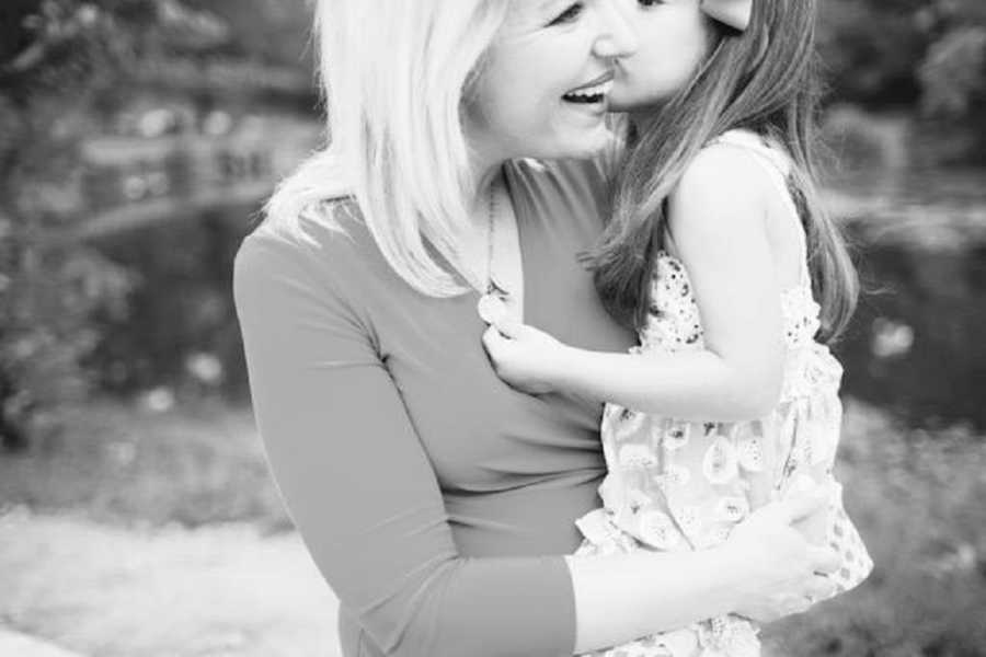 Mother who lost her first two kids smiles as she holds her third daughter