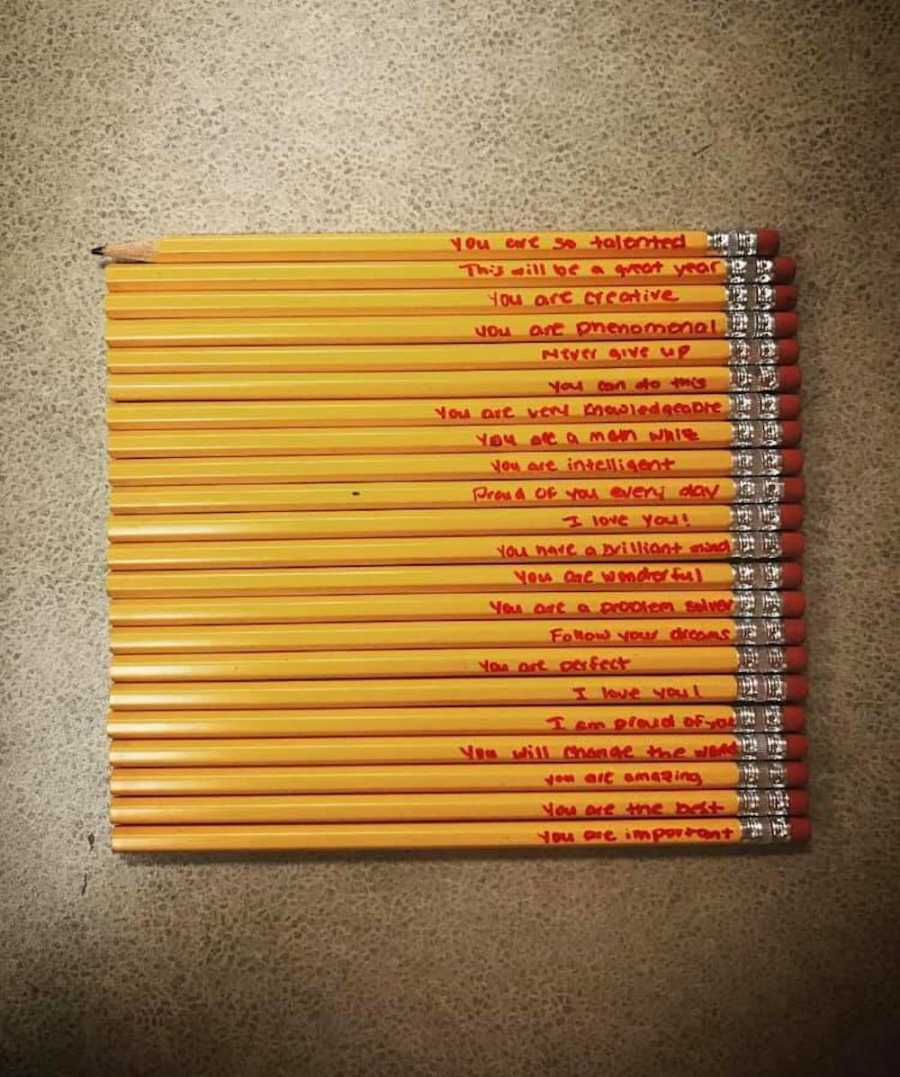 Row of pencils with positive affirmations that student's mother wrote on them