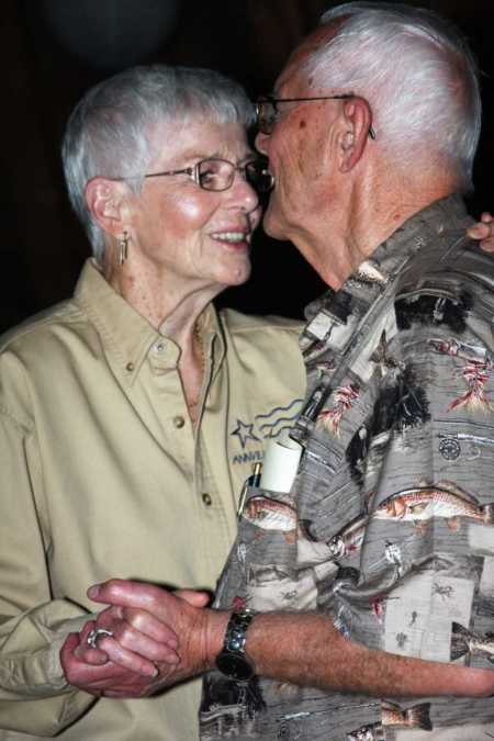 Elderly husband and wife dance closely before she had dementia