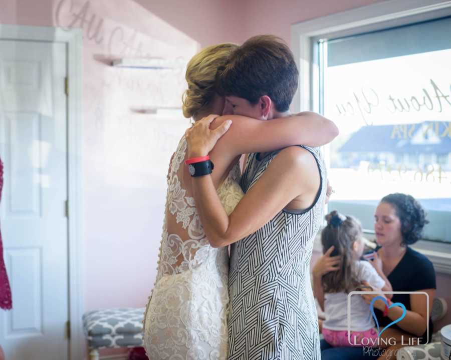 Bride hugs late grooms mother on the day of their wedding