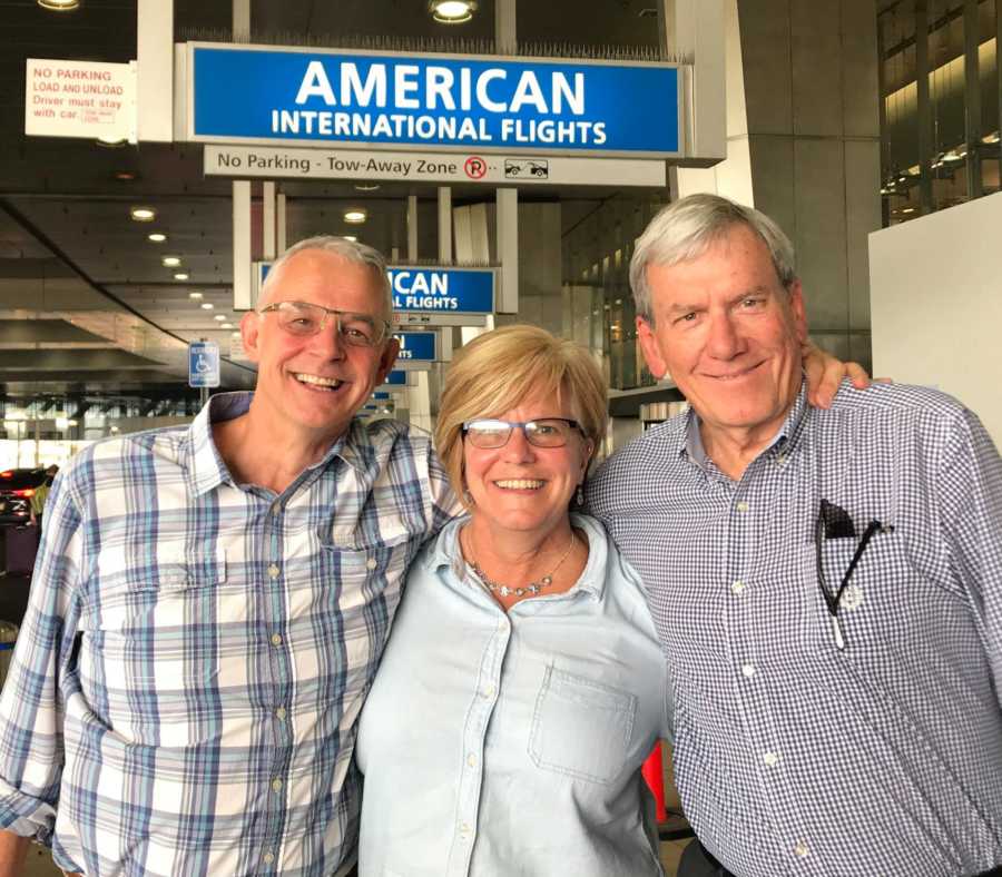 Man who was a foreign exchange student as a teen stands with his host sister and her husband