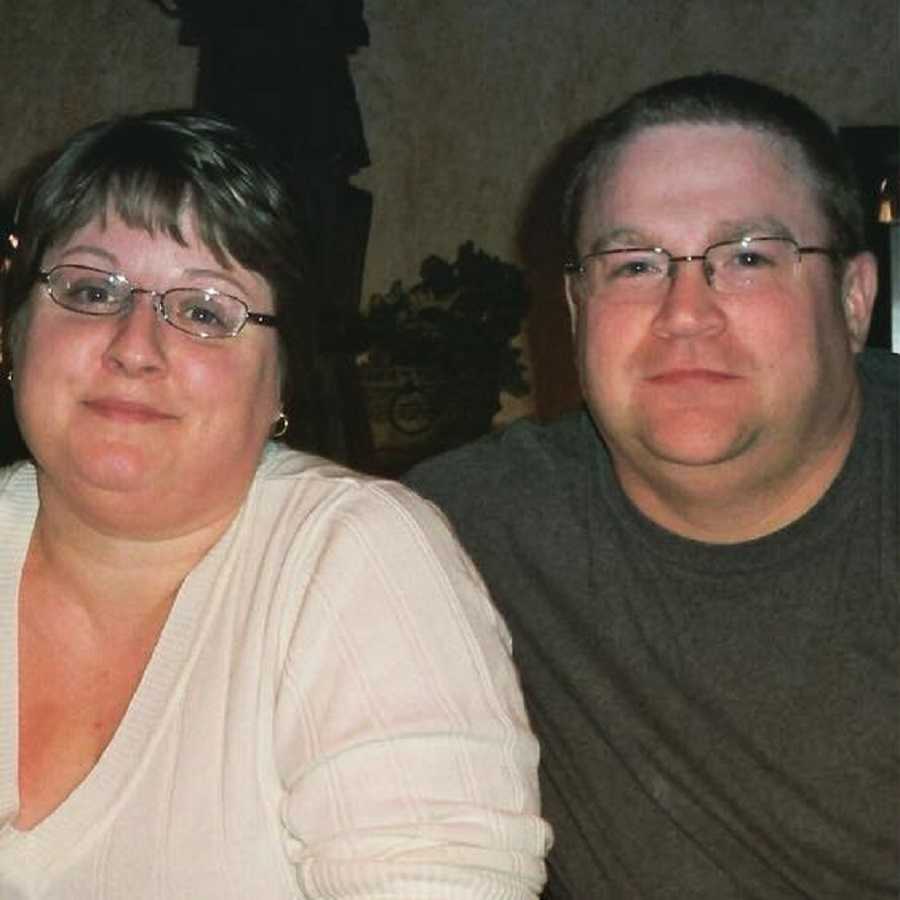 Husband and wife who both gained weight since marriage sit side by side smiling
