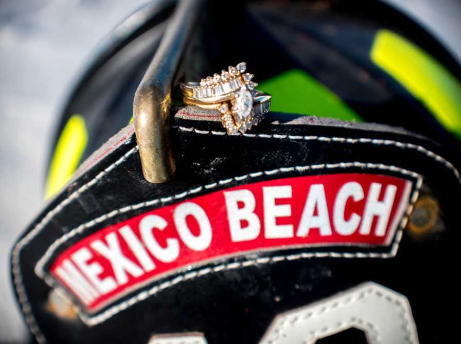 Fireman's hat with wedding rings resting on it