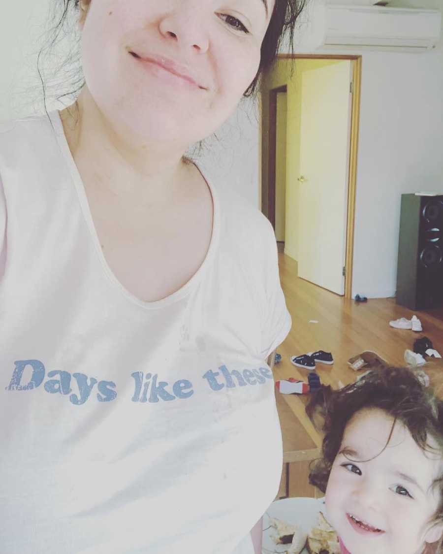Mother who tells other mother's to go easy on themselves smiles in selfie with toddler son