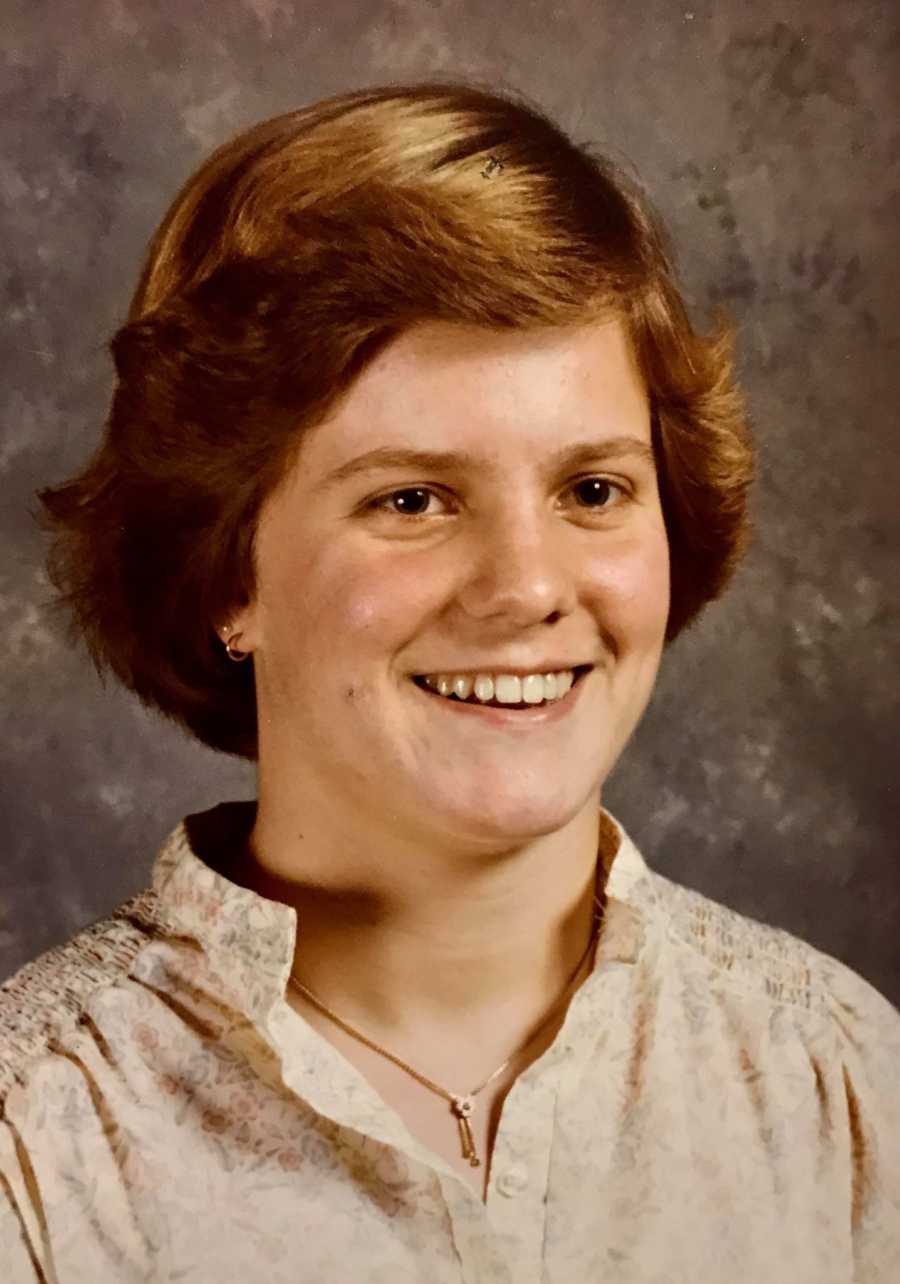 Woman smiling for school picture who will be married four times