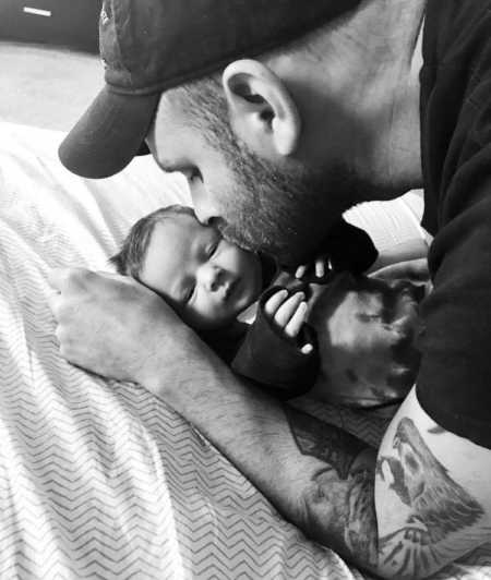 Father with PTSD from army kisses newborn daughter on cheek 