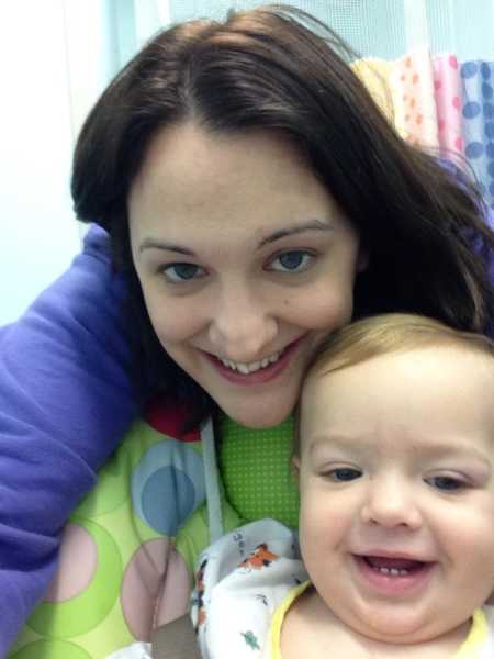 Woman who was diagnosed with HELLP and preeclampsia smiles in selfie with son