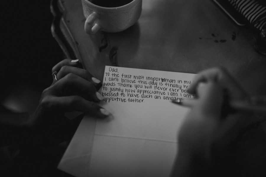 Aerial view of bride writing her father a letter