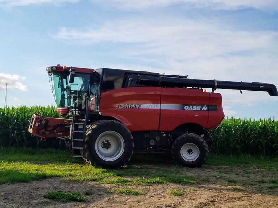 Tractor in field that belonged to girl's grandfather who he let her drive