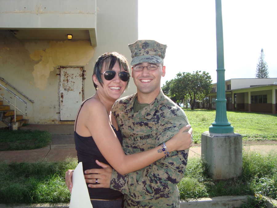 Boyfriend and girlfriend hug at boyfriend's deployment