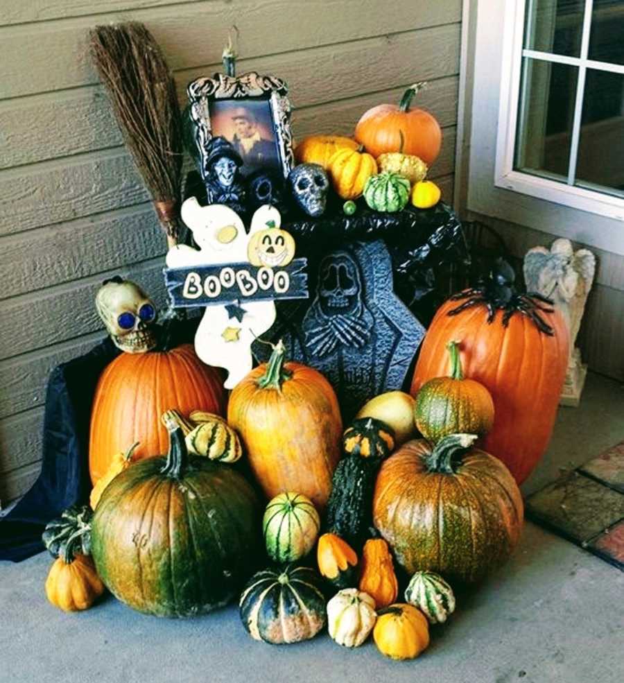 Pumpkin's and other Halloween decorations sit outside of front door