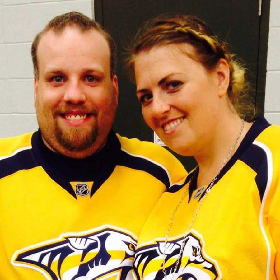 Couple smiles while wearing Nashville Predators jerseys