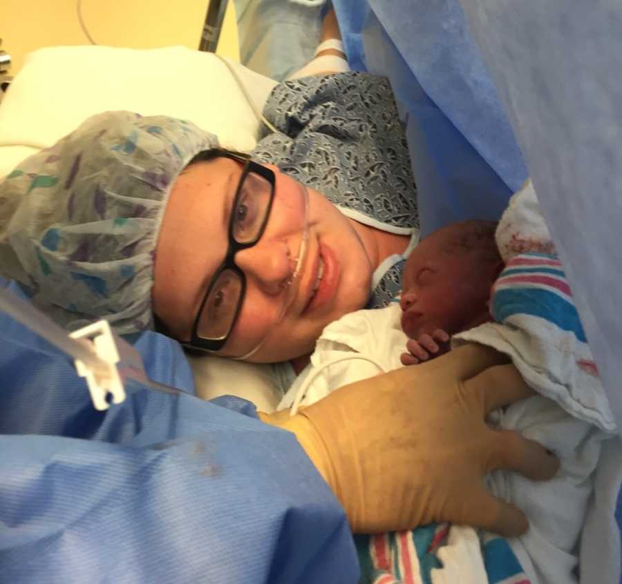 Woman who just gave birth smiles with newborn before she was taken to NICU