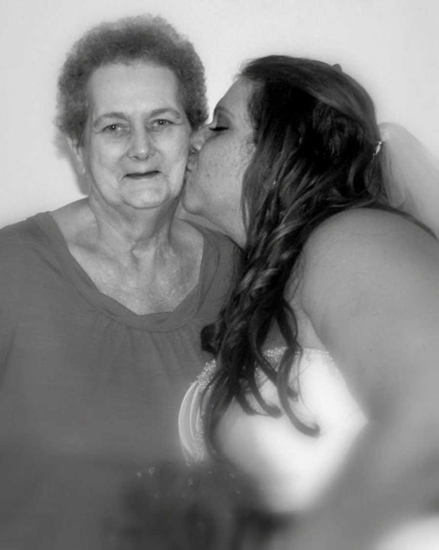 Woman kisses grandmother on the cheek who has since passed away