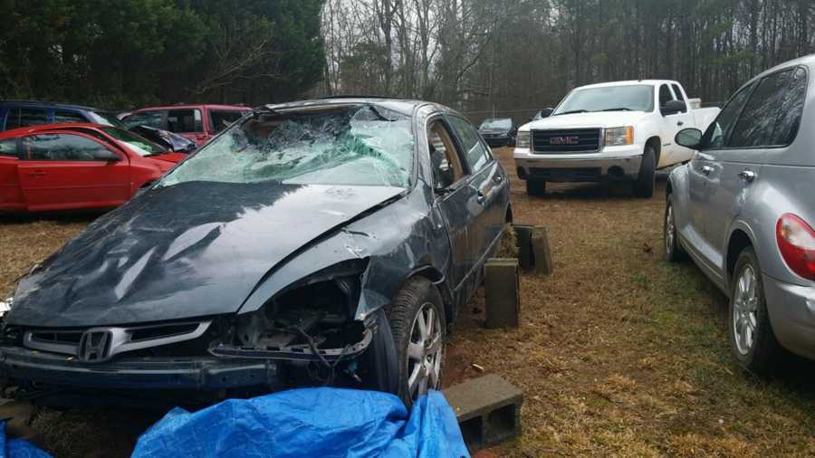 Wrecked car from crash that paralyzed woman from waist down
