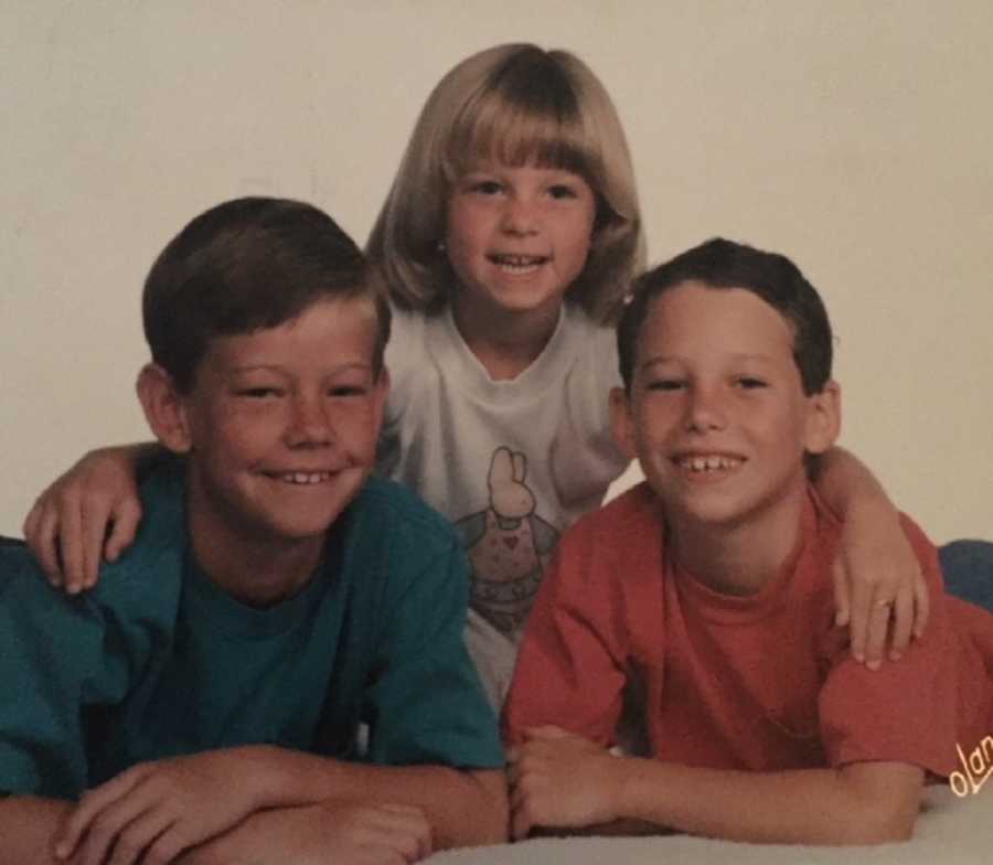 Young boy smiling with brother in sister in photoshoot who will later in life die from smoking a heroin-laced joint