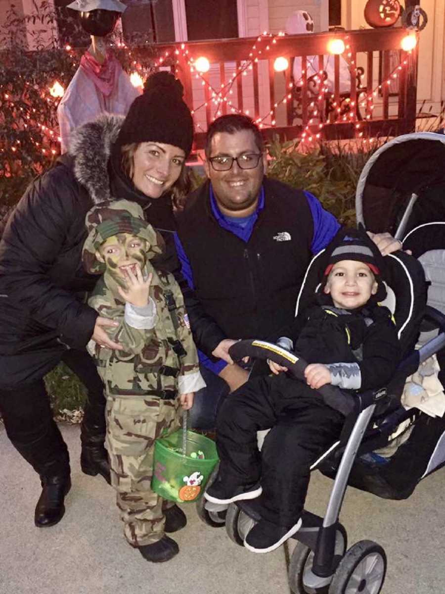 Husband and wife kneel beside son dressed in camo and son with Febrile Seizures in stroller
