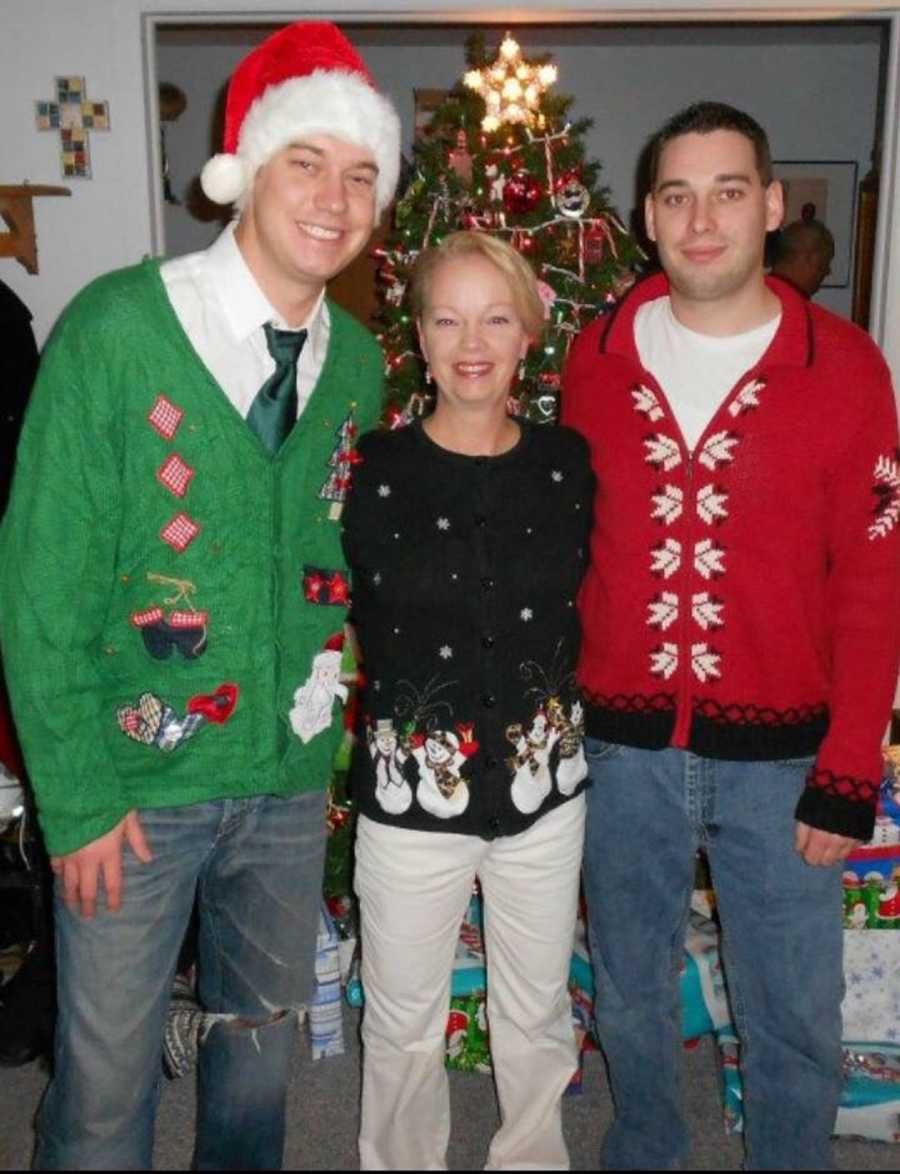 Man who will later in life die from smoking a heroin-laced joint stands in Christmas sweater beside brother and mom