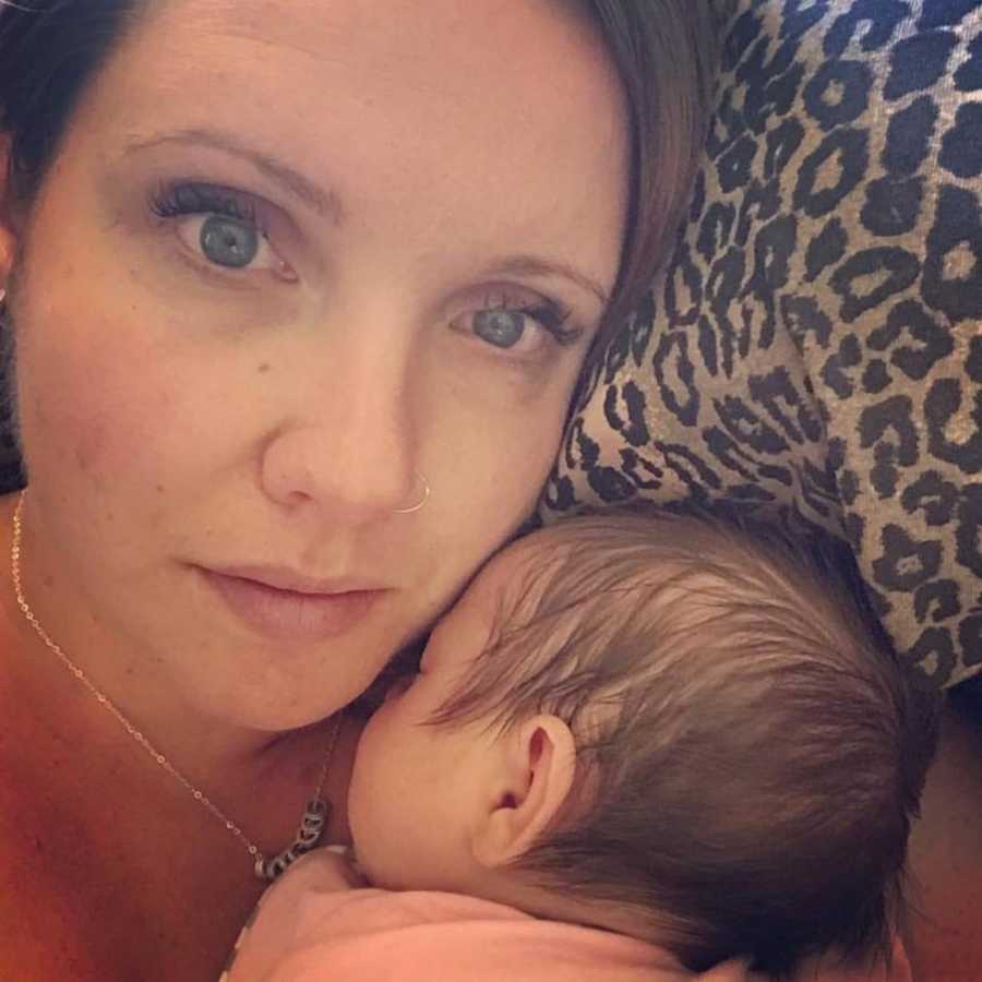 Drug addict mother takes selfie while baby is asleep on her chest