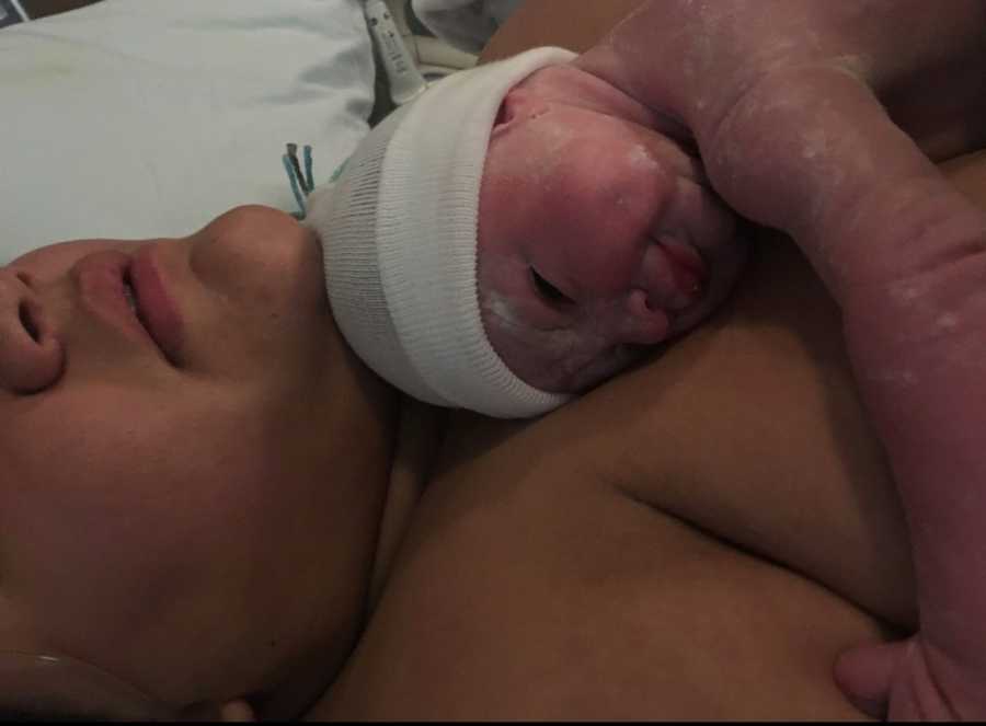 Newborn laying on mothers bare chest