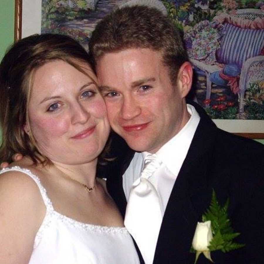 Bride and groom smiling before groom weighed 300 pounds