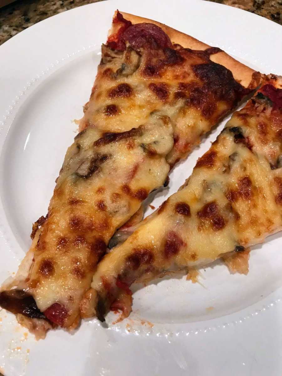 Pizza on a plate from man's favorite pizza place that delivered out of state for him