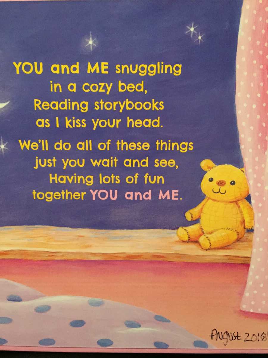 Page of children's book that says, "You and me snuggling in a cozy bed..."