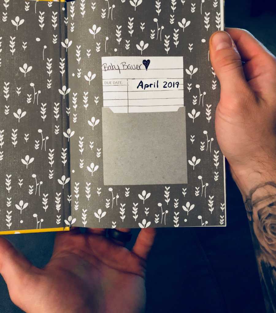 Opened book that has slip of paper that says, "Baby Bauer April 2019"