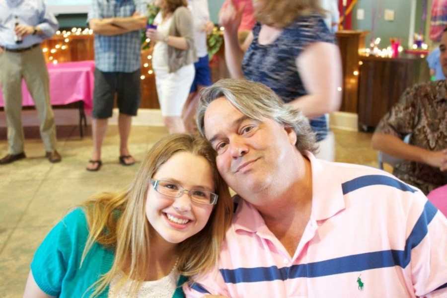 Woman smiles as she sits beside her husband