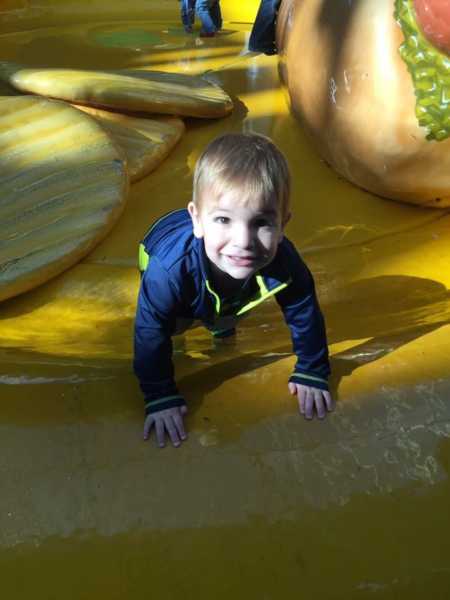 Toddler with Febrile Seizures crawls on play structure