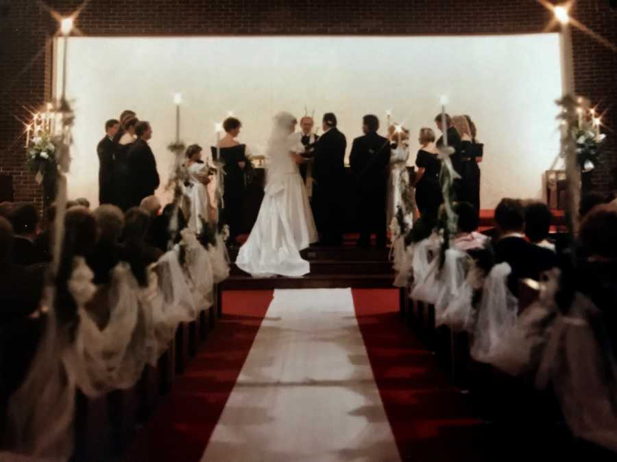 Bride and groom standing at altar in church