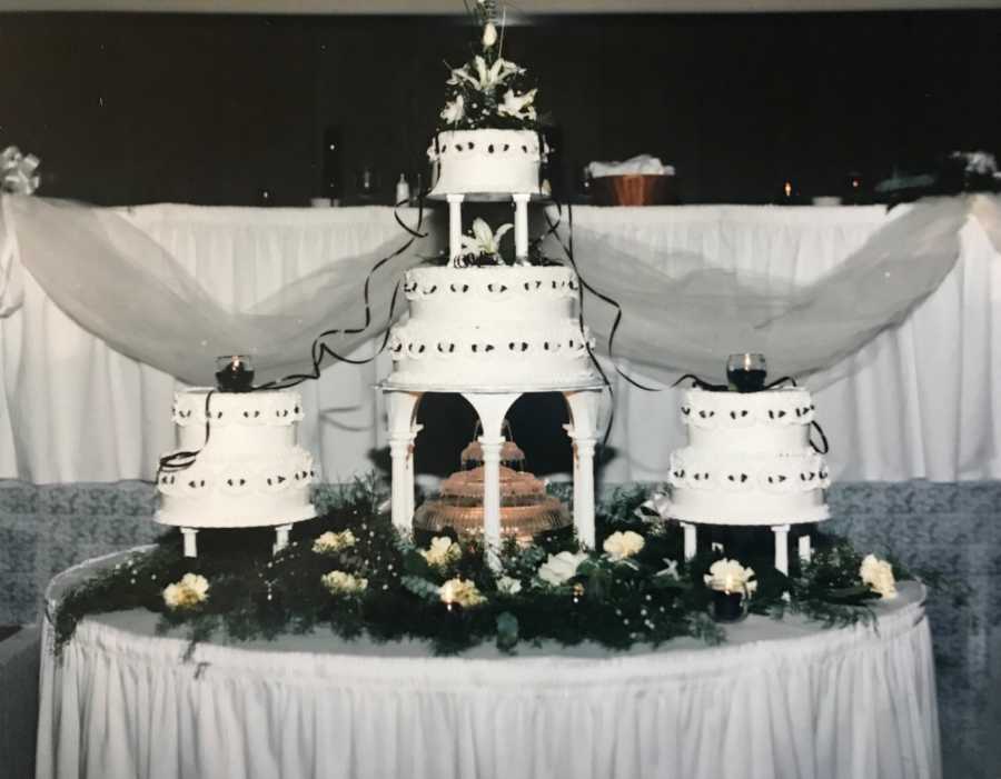 Three wedding cakes on table at wedding reception