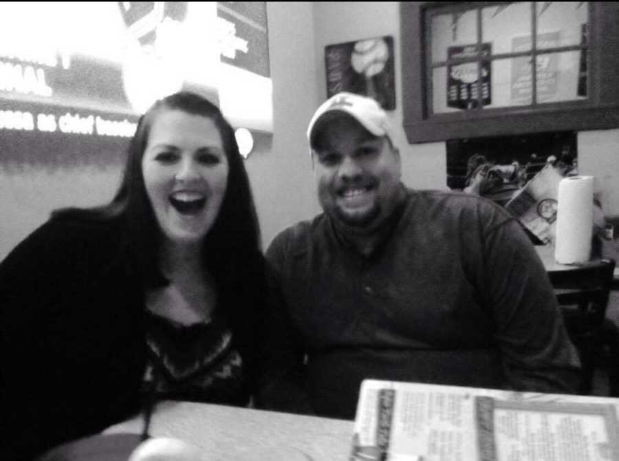 Couple smiling at restaurant table