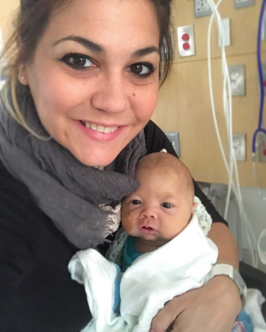 Mother sits in hospital holding baby with HLH who will never return home