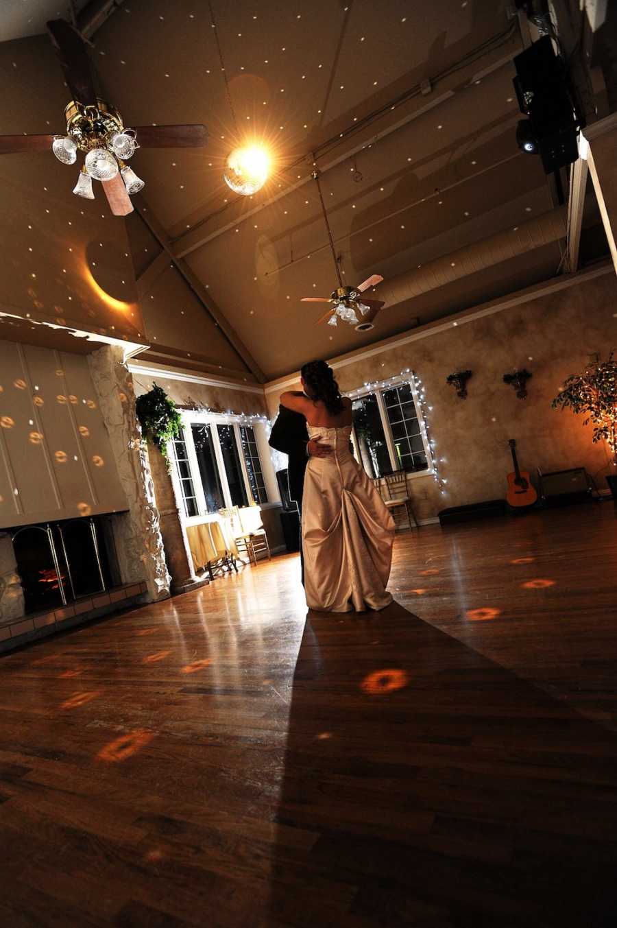 Bride and groom who has since passed away dance at wedding reception