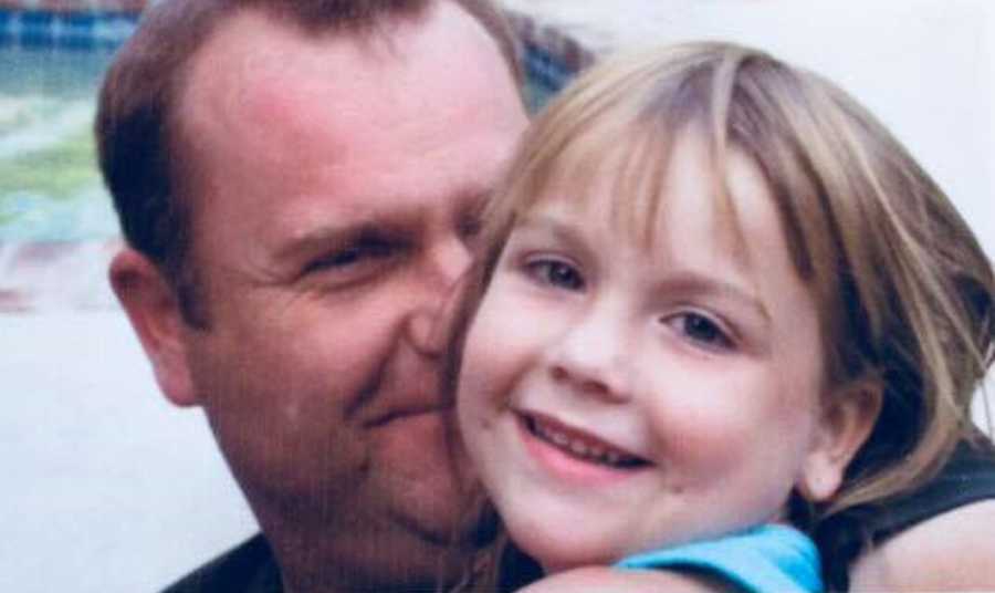 Close up of father who has since passed away smiling while holding young daughter