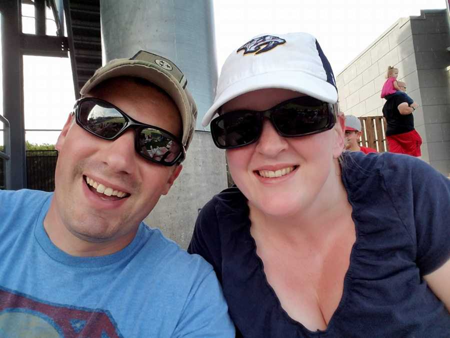 Active duty service member smiles in selfie with wife