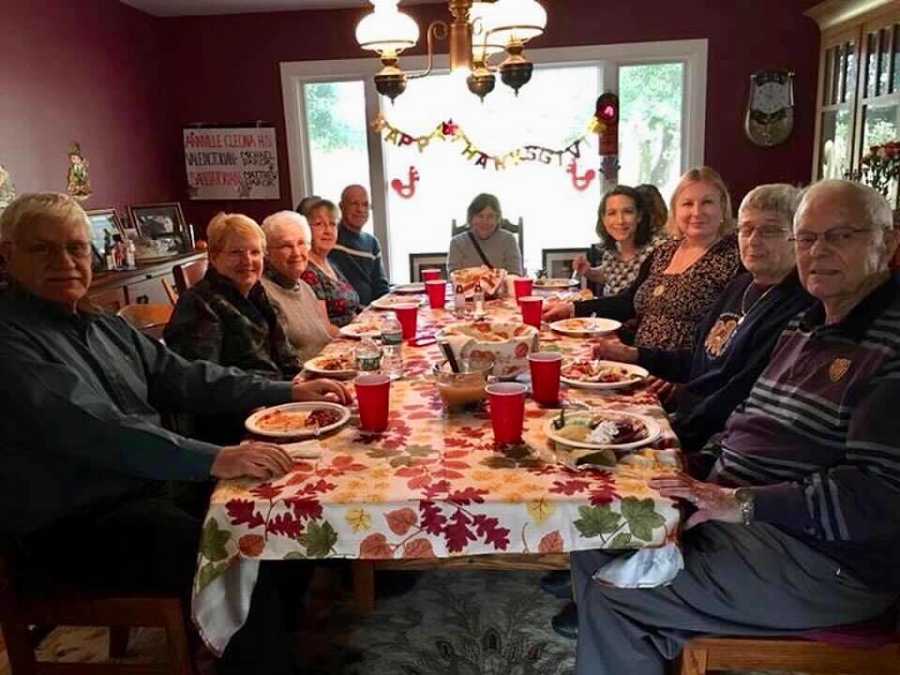 Dining room table filled with people for Thanksgiving