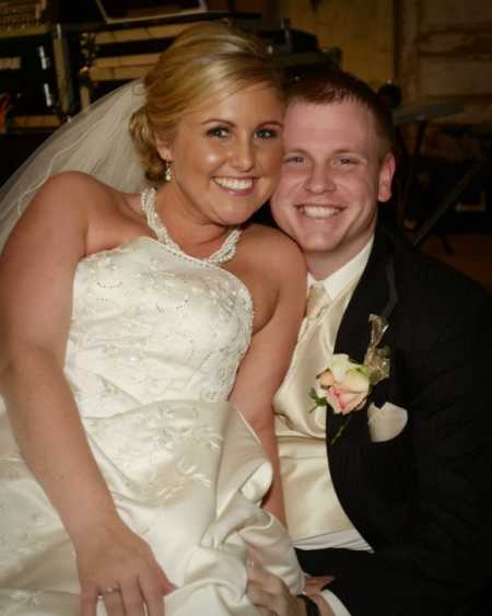 Bride sits on grooms lap who is paralyzed from car crash from when he was a teen