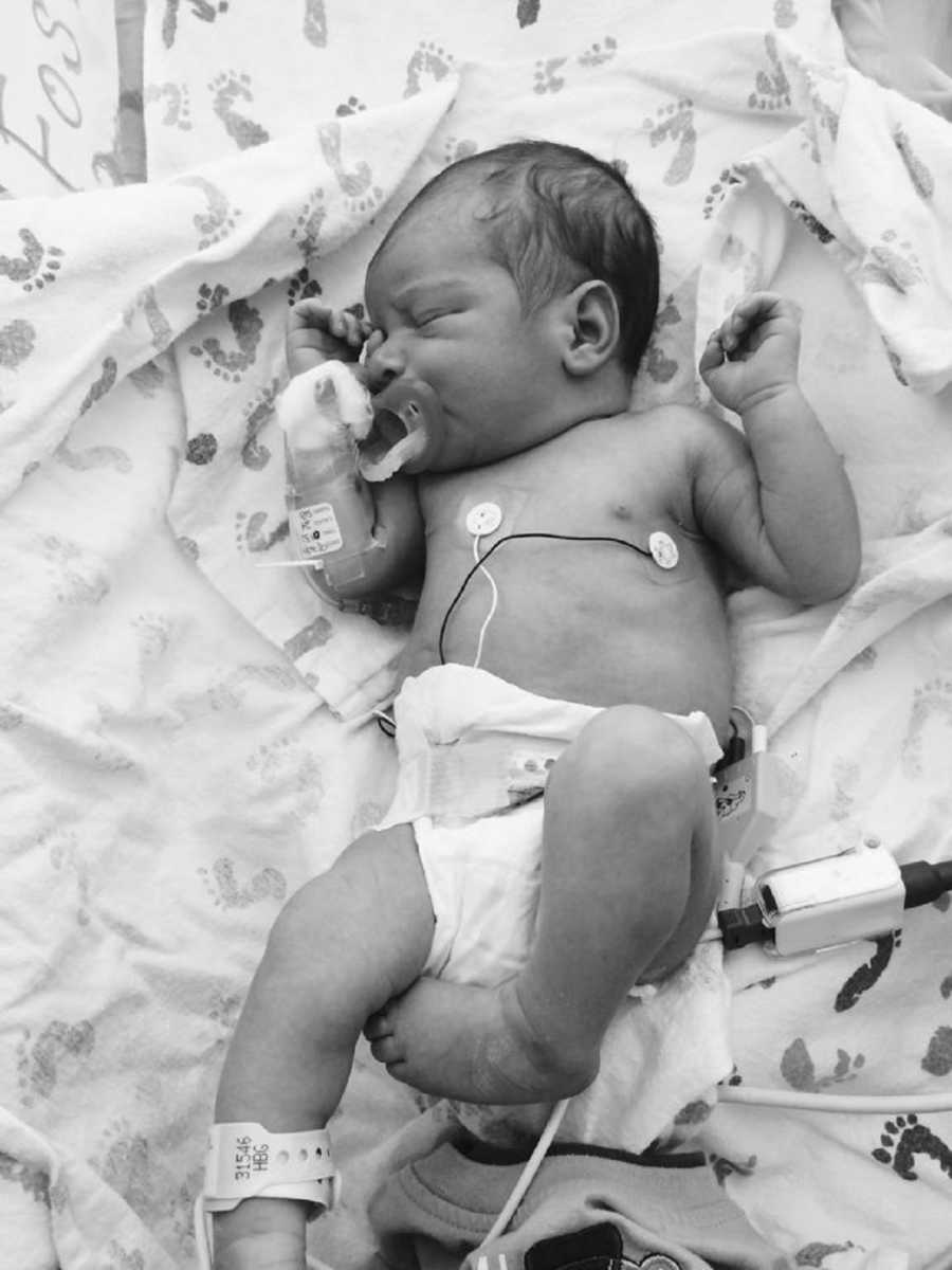 Newborn baby lying in NICU who needs home