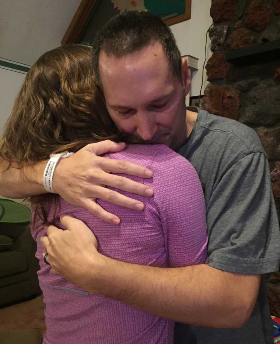 Father who has since passed hugs his daughter