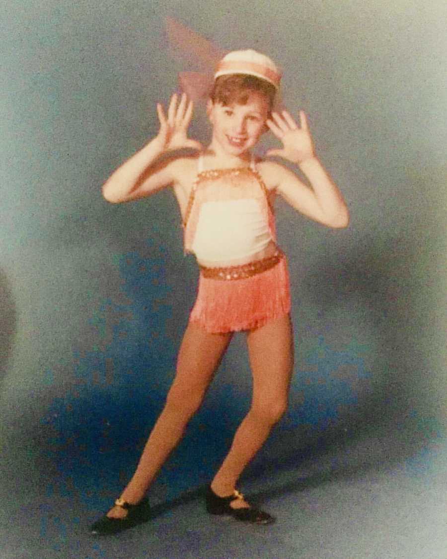 Little girl posing in dance recital costume in photoshoot