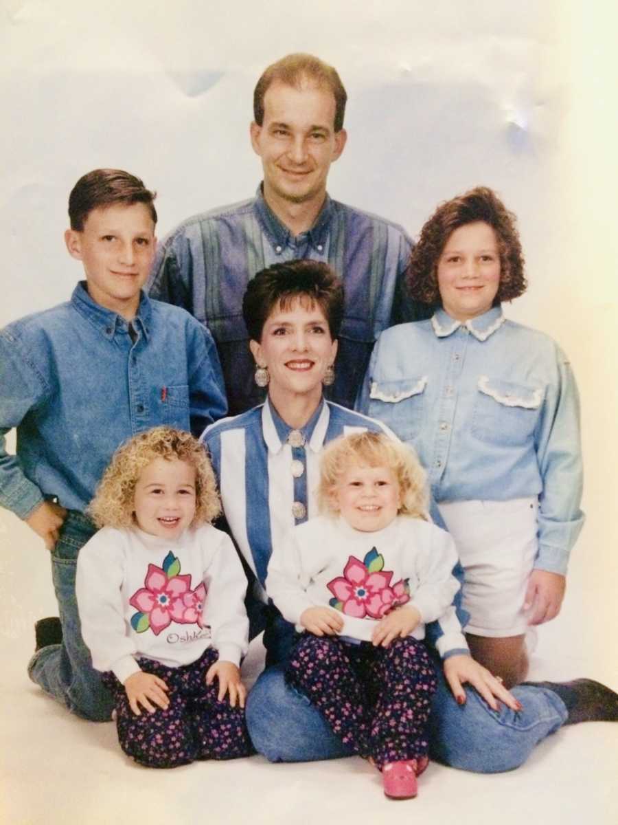 Family of six smiling for family photoshoot