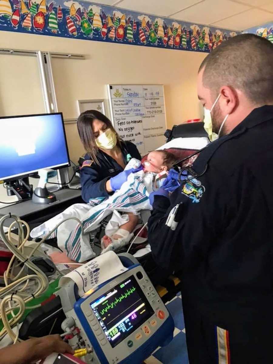 EMT's tending to baby with RSV in children's hospital 