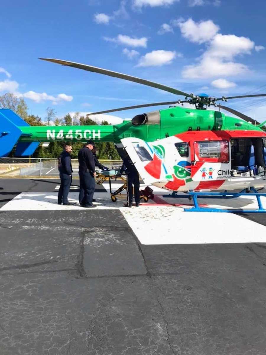 EMT's loading baby onto Children's Hospital helicopter