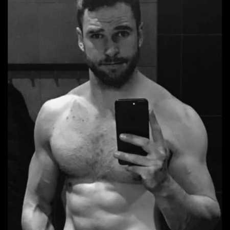 Fit shirtless man takes mirror selfie