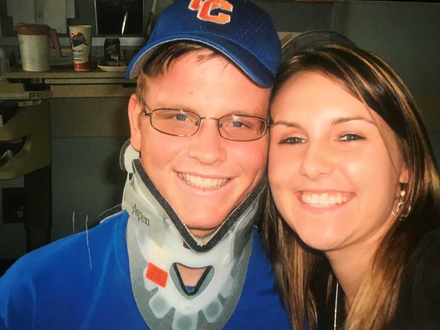 Teen who suffered spinal chord injury from car crash smiles with neck brace on beside girlfriend 
