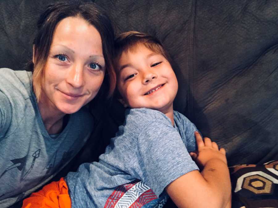 Mother who feels like she is a bad mom smiles in selfie with young son