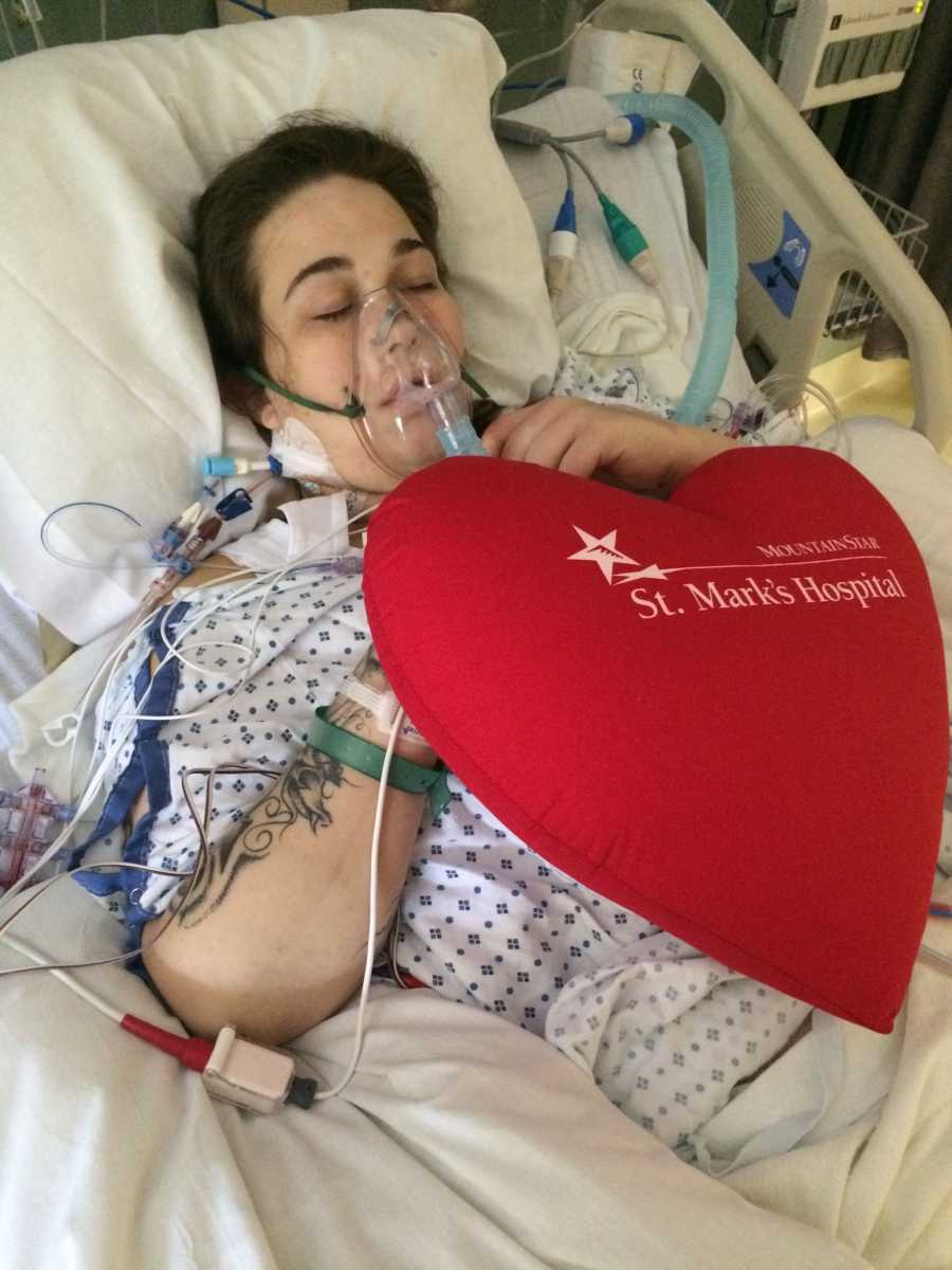Young woman laying in hospital bed on oxygen from abusing drugs
