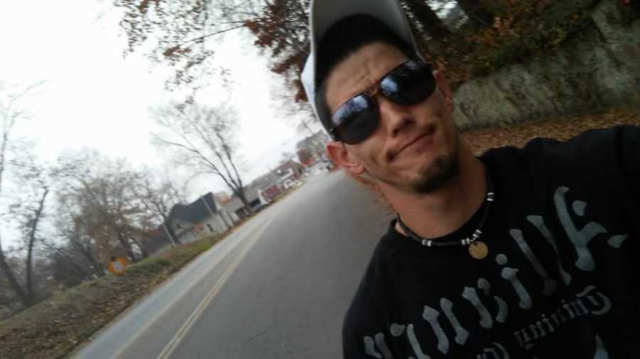 Man addicted to drugs takes selfie as he walks down road